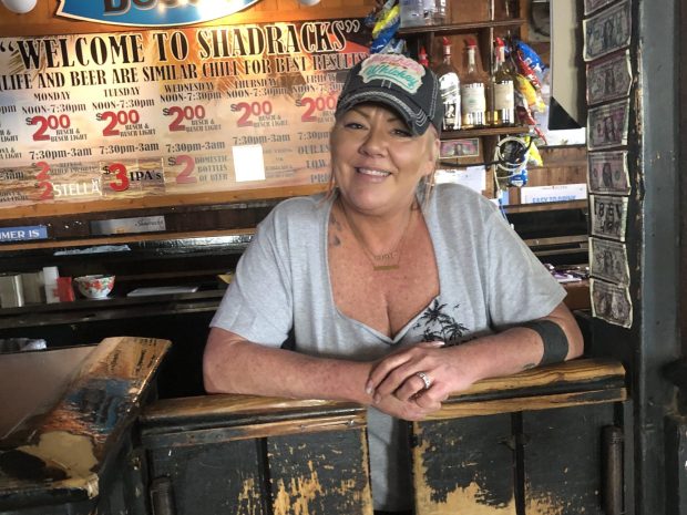 Biscuit Shannon, a bartender, stands inside Shadracks bar in Pass-a-Grille on Aug. 28, 2023. Shannon said she had no plans to evacuate before Idalia. (Lane DeGregory/Tampa Bay Times)