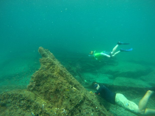 In this file photo, a snorkeler visits the shipwreck of the Lofthus off the coast of Boynton Beach, along with a guide. (Maria Lorenzino/South Florida Sun Sentinel)