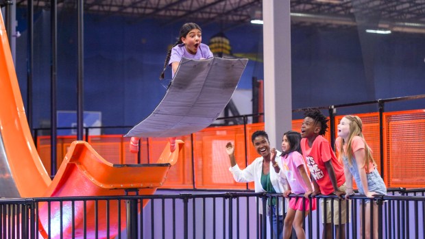 A girl soars off the slide on Sky Zone's Mega Launch. (Sky Zone/Courtesy)