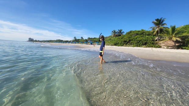 A young snorkeler gets ready to get into the water at Red Reef Park in Boca Raton. The area is good for children to learn how to snorkel since the reef is close to shore. (City of Boca Raton/Courtesy)