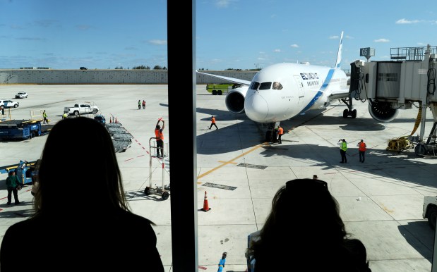 People watch as El Al Israel Airlines makes its inaugural visit to the Fort Lauderdale-Hollywood International Airport in Fort Lauderdale on Monday, April 15, 2024. (Carline Jean/South Florida Sun Sentinel)