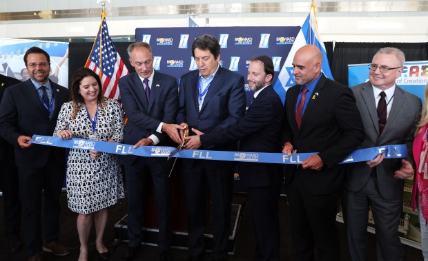 Dignitaries cut the ribbon celebrating El Al Israel Airlines year-round service to Tel Aviv at Fort Lauderdale-Hollywood International Airport in Fort Lauderdale on Monday, April 15, 2024. (Carline Jean/South Florida Sun Sentinel)