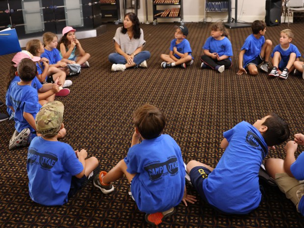  Valeria Michanie, Lifelong Learning director for Temple Kol Ami Emanu-El in Plantation, is seen here providing instructions to synagogue campers on Friday, July 19, 2024. Michanie said she needs six teachers in almost every grade for her staff of 20 instructors.(Brielle Aguayo/South Florida Sun Sentinel) 