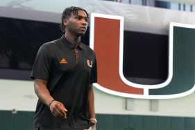 Miami quarterback Cam Ward walks inside the team's training facility during NCAA college football media day, Tuesday, July 30, 2024, in Coral Gables, Fla. Ward and the Hurricanes are No. 19 in the preseason AP poll. (AP Photo/Marta Lavandier)