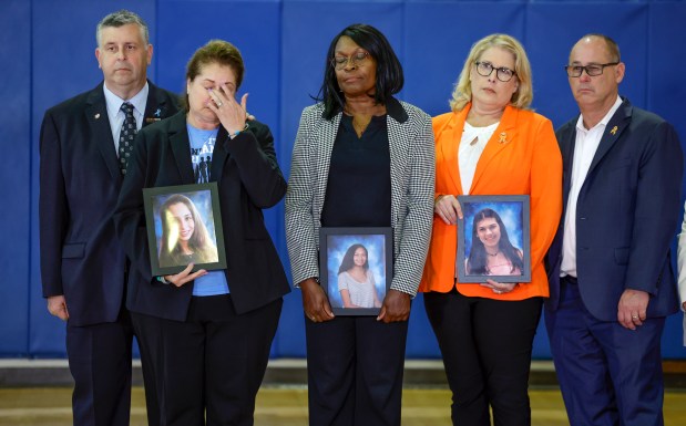 The family of students who were killed during the shooting at Marjory Stoneman Douglas High School six years ago react as Vice President Kamala Harris speaks during a visit to the school in Parkland on Saturday, March 23, 2024. Left to right are Tony and Jennifer Montalto, parents of Gina, Anne Ramsay, mother of Helena, and Fred and Jennifer Guttenberg, parents of Jaime. The vice president and the White House Office of Gun Violence Prevention met with families whose loved ones were murdered during the 2018 mass shooting. (Al Diaz/Miami Herald)