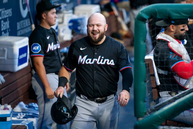 Miami Marlins' Jake Burger reacts to scoring on the single by Jonah Bride during the first inning of a baseball game against the Philadelphia Phillies, Tuesday, Aug. 13, 2024, in Philadelphia. (AP Photo/Chris Szagola)