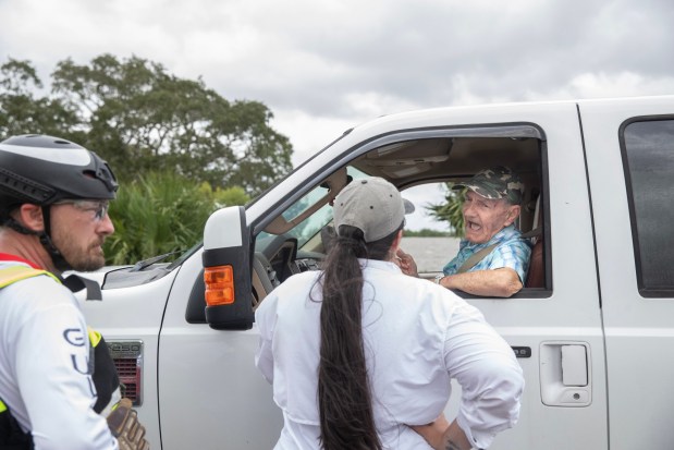 Cedar Key resident Herman Wells becomes emotional when he finds out they will not let him cross the causeway to his home after Hurricane Idalia flooded streets and homes in Cedar Key, Fla., Wednesday, Aug. 30, 2023. (Willie J. Allen Jr./Orlando Sentinel)