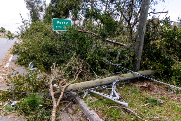 Downed trees and power lines can be seen heading into Perry, Fla., on Thursday, Aug. 31, 2023. Taylor County felt the full impacts of Hurricane Idalia, which made landfall near Category 4 strength on Wednesday morning. (Patrick Connolly/Orlando Sentinel)