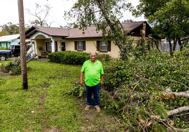 Deacon Carl Williams stands outside of his home in Perry, Fla., surrounded by tree debris on Thursday, Aug. 31, 2023. Taylor County felt the full impacts of Hurricane Idalia, which made landfall near Category 4 strength on Wednesday morning. (Patrick Connolly/Orlando Sentinel)