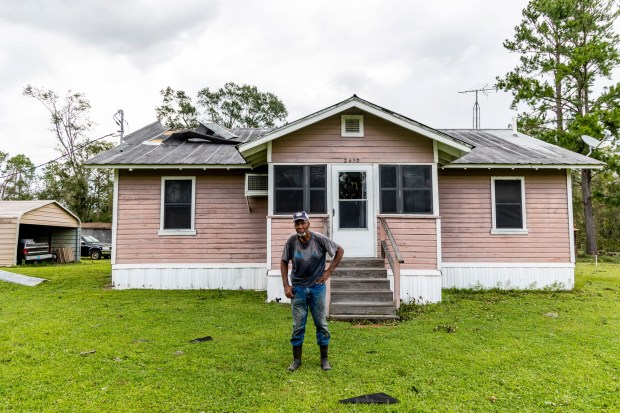 Deacon Freddie Richet stands outside the 1950s home that once belonged to his parents in Taylor County on Thursday, Aug. 31, 2023. The county felt the full impacts of Hurricane Idalia, which made landfall near Category 4 strength on Wednesday morning. (Patrick Connolly/Orlando Sentinel)