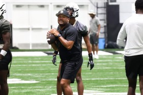 UCF offensive coordinator Tim Harris Jr. works out with the receivers during fall practice on Monday, Aug. 12. Harris said the Knights have been pushing themselves this camp, which will help them prepare for the upcoming season. (Rich Pope, Orlando Sentinel)