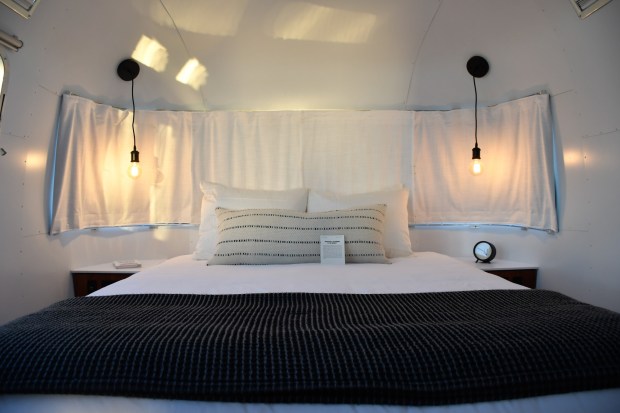 AutoCamp Joshua Tree's Airstream trailers include a sitting room, bathroom and bedroom with upscale linens. AutoCamp now has a booking arrangement with Hilton. (Christopher Reynolds/Los Angeles Times/TNS)